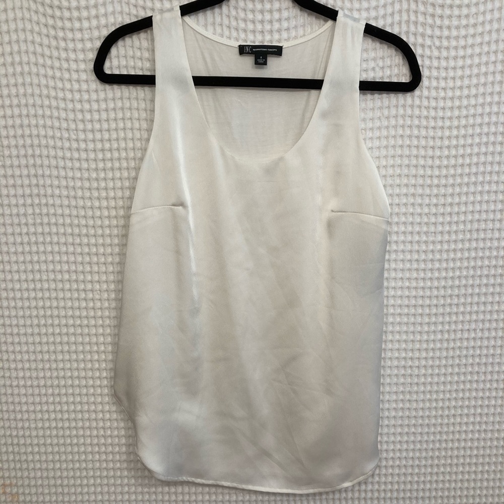 Silky, white top. Size small.